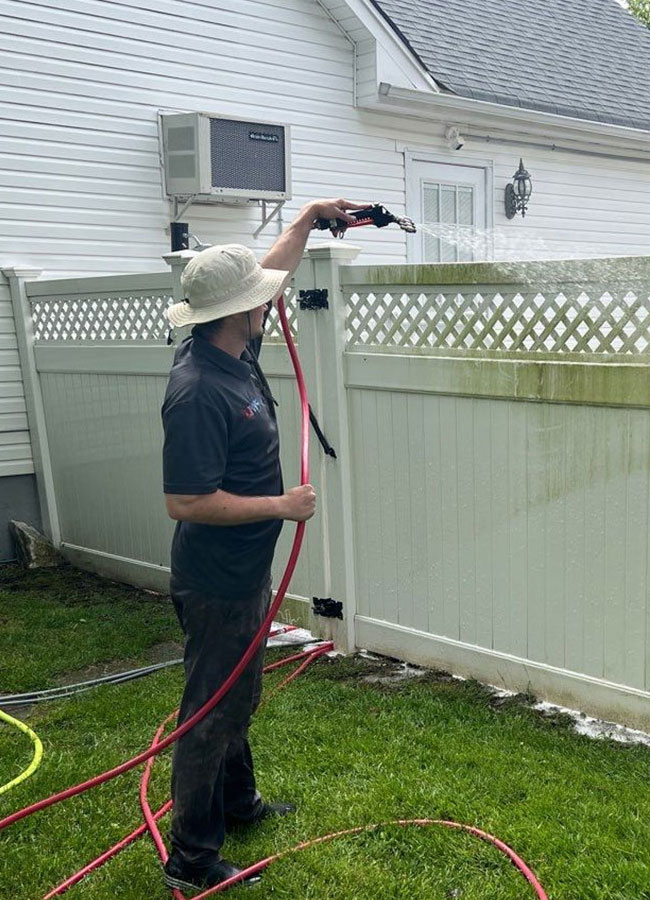 Matthew soft washing PVC fence — exterior cleaning Long Island NY by Pressure Wash Long Island